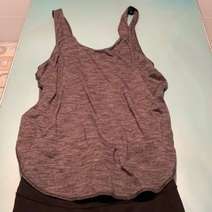 Unique Lululemon 1 piece tank and black tights from the Lab